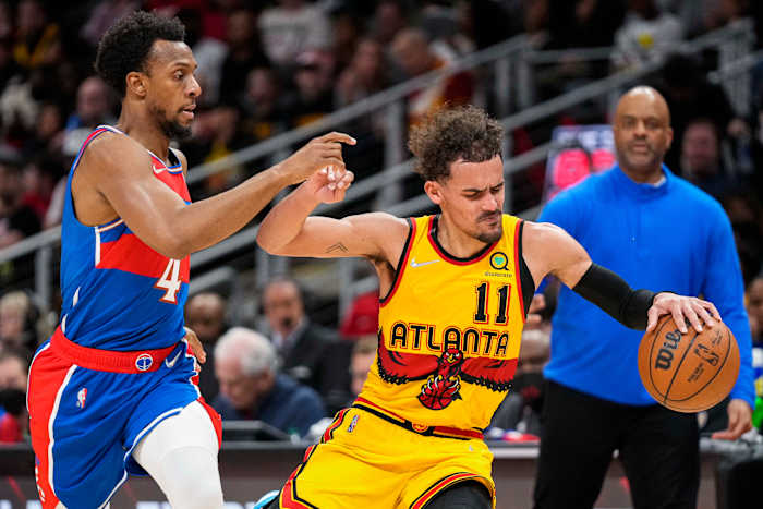 Apr 6, 2022; Atlanta, Georgia, USA; Atlanta Hawks guard Trae Young (11) is defended by Washington Wizards guard Ish Smith (4) during the second half at State Farm Arena.